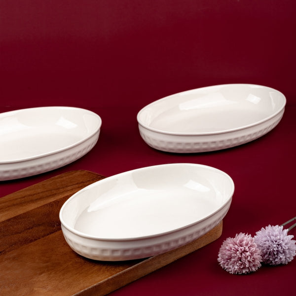 Ariane 10'' x 6 1/2'' Slow Fast - Warm White Porcelain Oval Caserole Deep Bowl - 3/Case (AOTARN000089026) - iFoodservice Online
