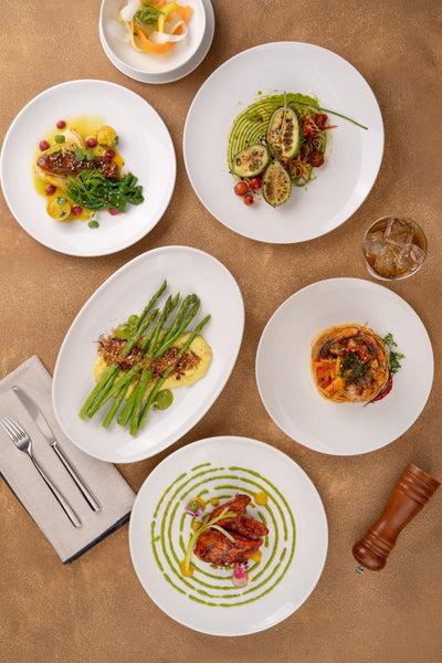 Ariane 12 1/5" Vital Coupe - Warm White Porcelain Elevated Plate - 6/Case (AVCARN000111031) - iFoodservice Online