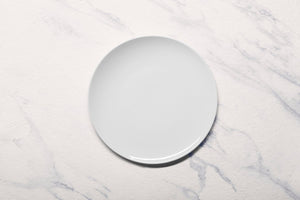 Ariane 9 4/9" Vital Coupe - Warm White Porcelain Coupe Elevated Plate - 12/Case (AVCARN000111024) - iFoodservice Online