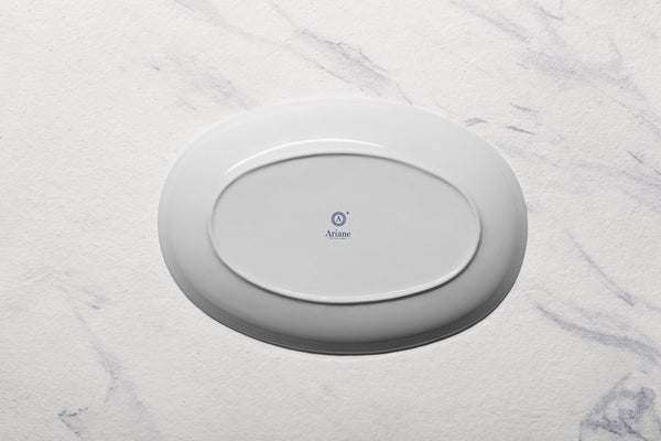 Ariane Vital Coupe 12 3/5" Vital Coupe - Warm White Porcelain Coupe Oval Plate - 6/Case (AVCARN000015032) - iFoodservice Online