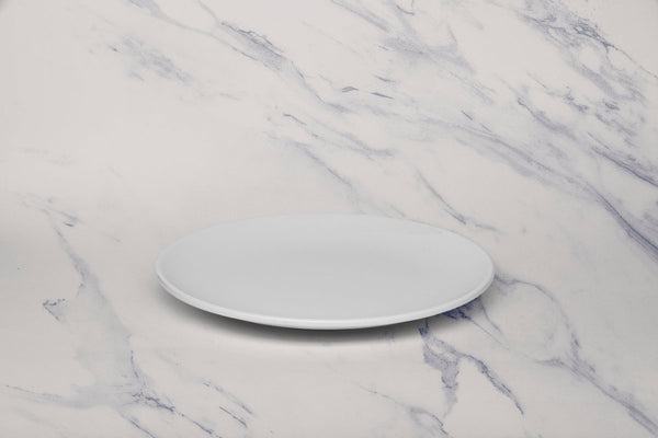 Ariane Vital Coupe 9 4/9" Vital Coupe - Warm White Porcelain Coupe Round Rimless Plate - 6/Case (AVCARN000011024) - iFoodservice Online